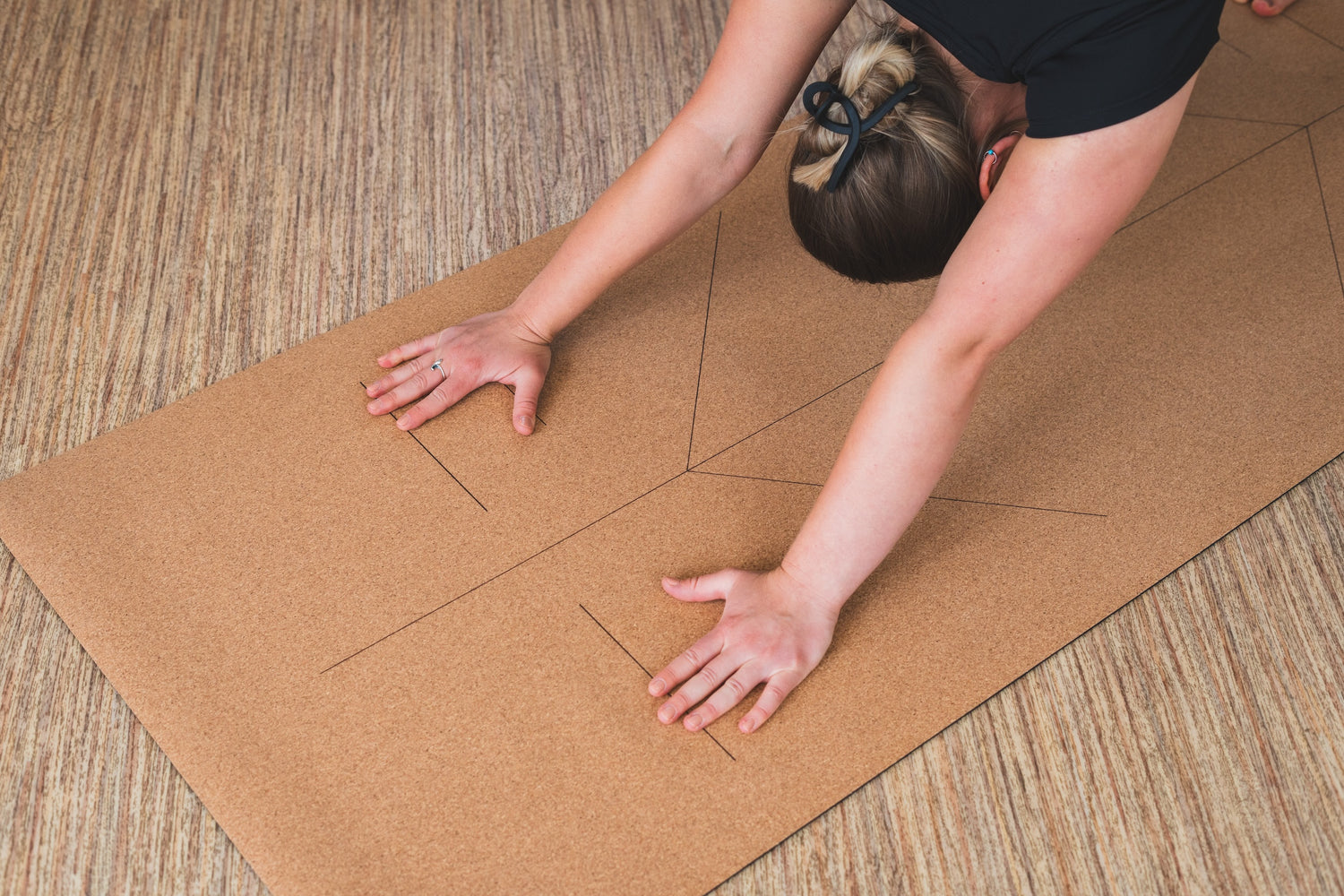 ROOTD Elite Elite Align Design. Non-toxic eco cork exercise mat being used in a gym setting with alignment lines